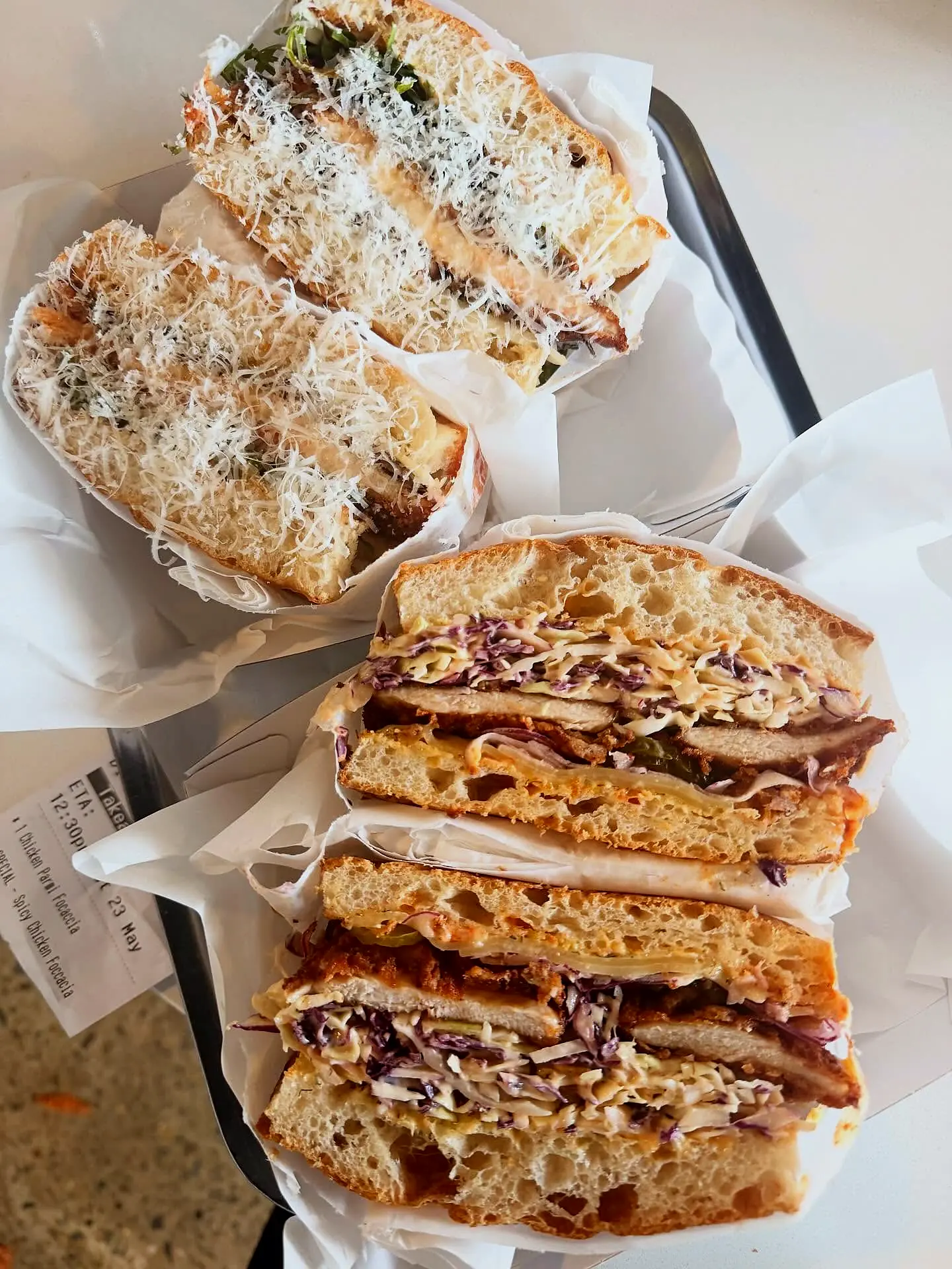 Their focaccias stacked on a steel tray